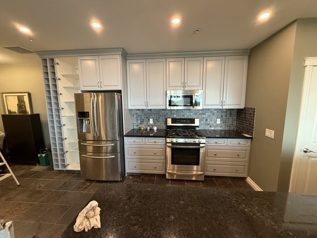 Kitchen cabinets after painting by Renovo Painting Inc, Calgary
