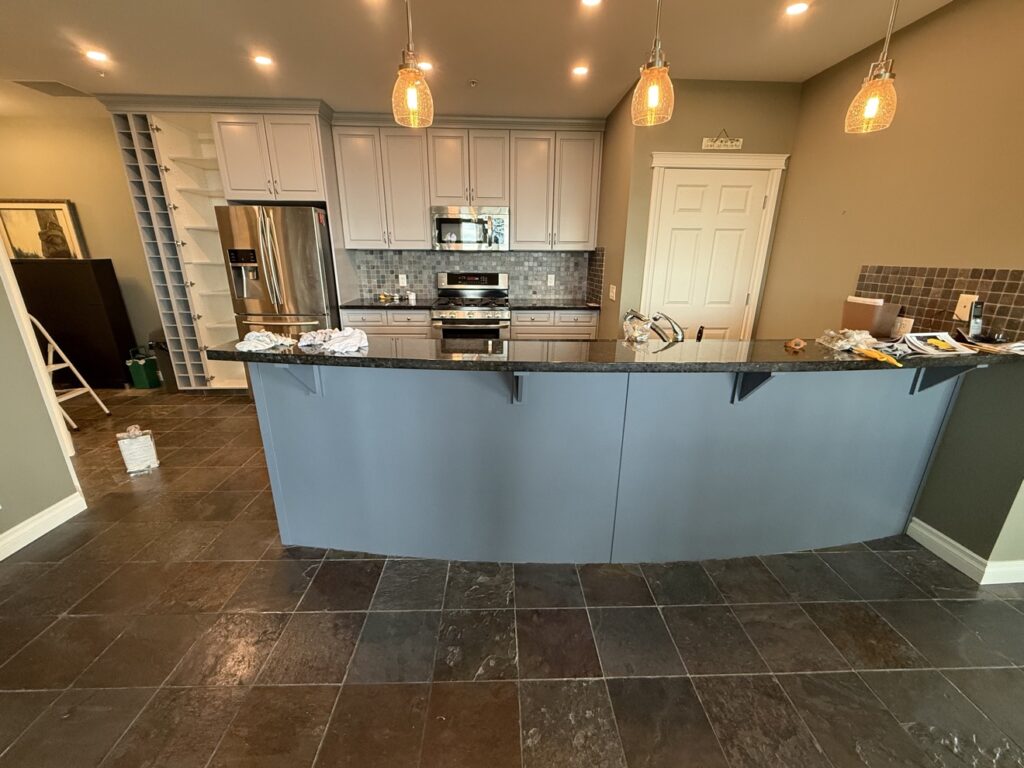 Kitchen cabinets after painting by Renovo Painting Inc, Calgary