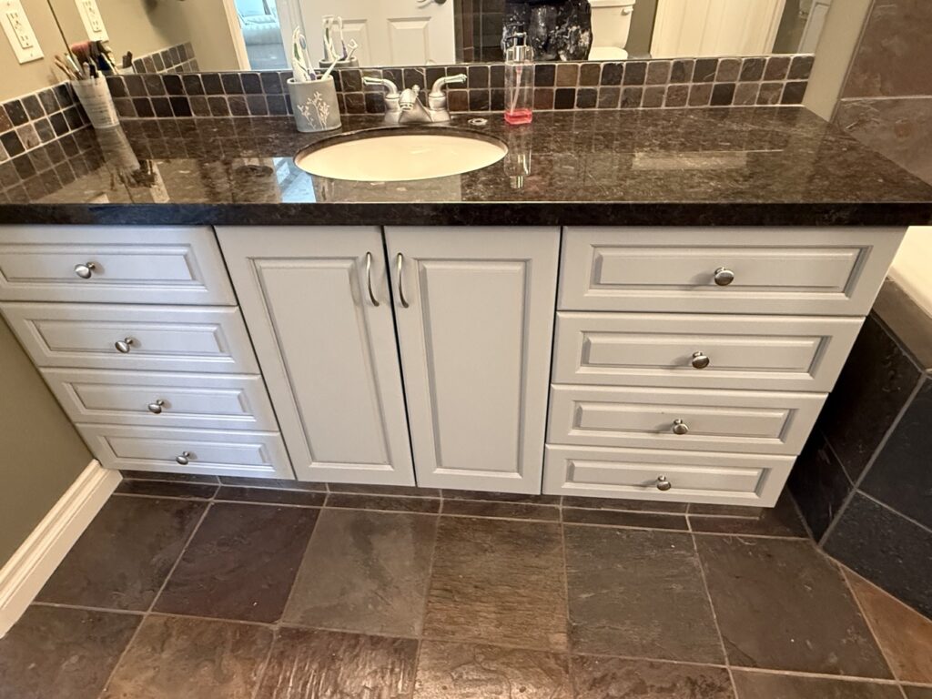 Bathroom vanity refinished by Renovo Painting Inc, Calgary