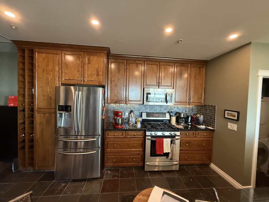 Kitchen cabinets before refinishing — wood cabinets in Calgary
