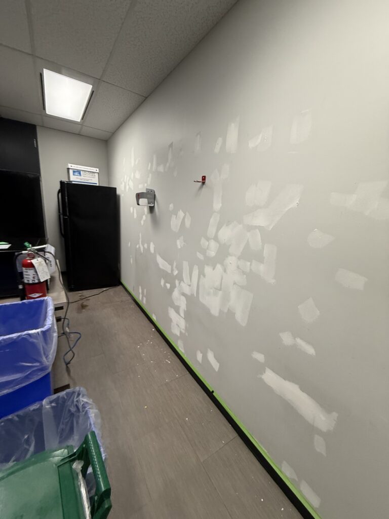 Commercial drywall patch repair by Renovo Painting Inc, Calgary