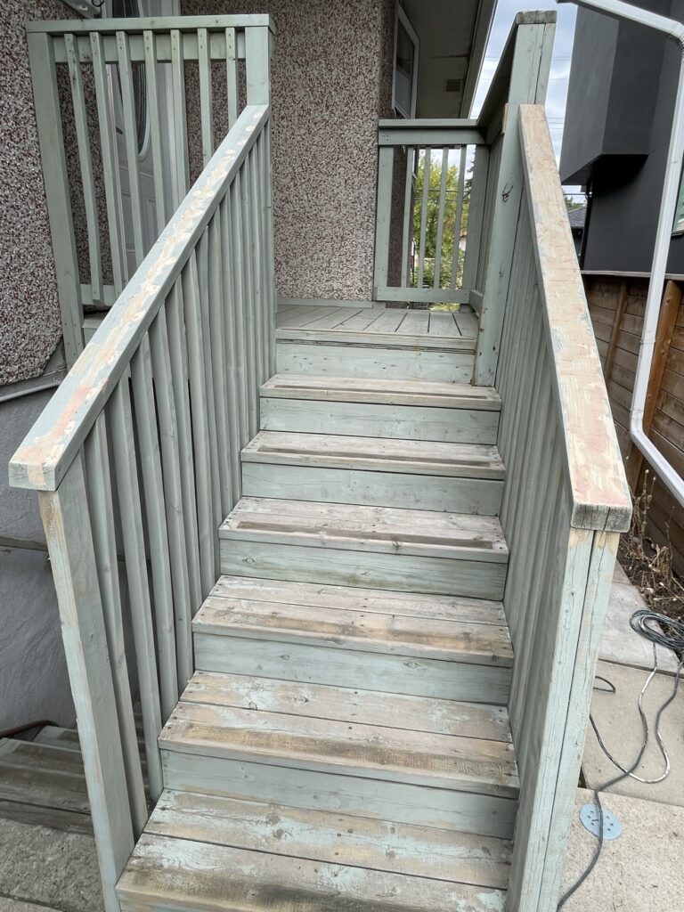 Weathered wooden deck stairs before painting by Renovo Painting Inc, Calgary