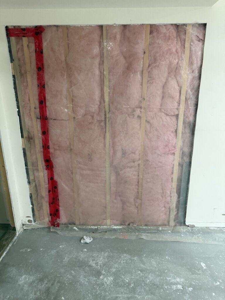 Basement insulation, drywall and painting project in Calgary by Renovo Painting Inc, during insulation and drywall work