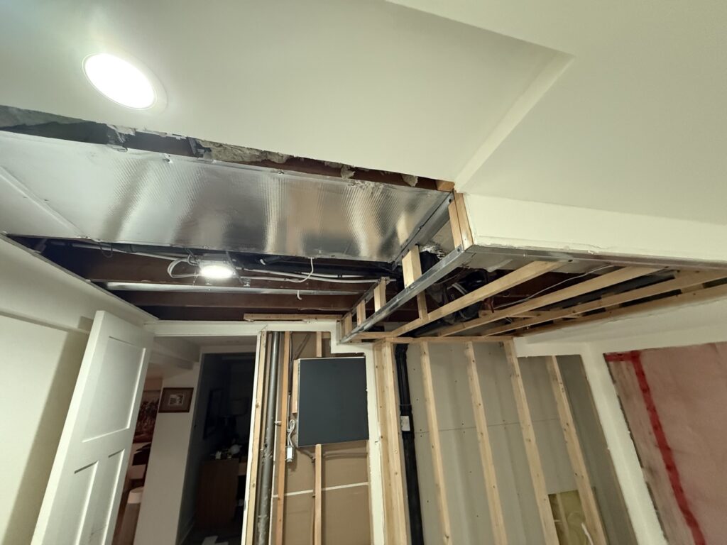 Basement insulation, drywall and painting project in Calgary by Renovo Painting Inc, during insulation and drywall work