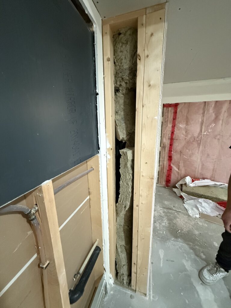 Basement insulation, drywall and painting project in Calgary by Renovo Painting Inc, during insulation and drywall work