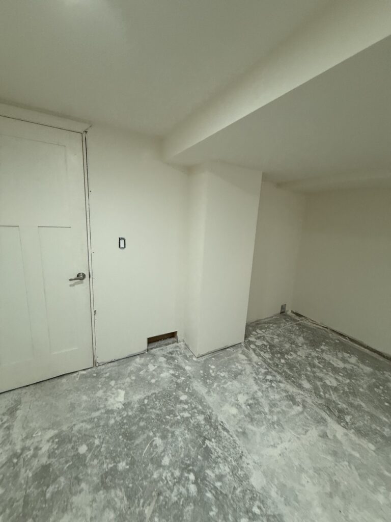 Basement insulation, drywall and painting project in Calgary by Renovo Painting Inc, finished painted basement walls