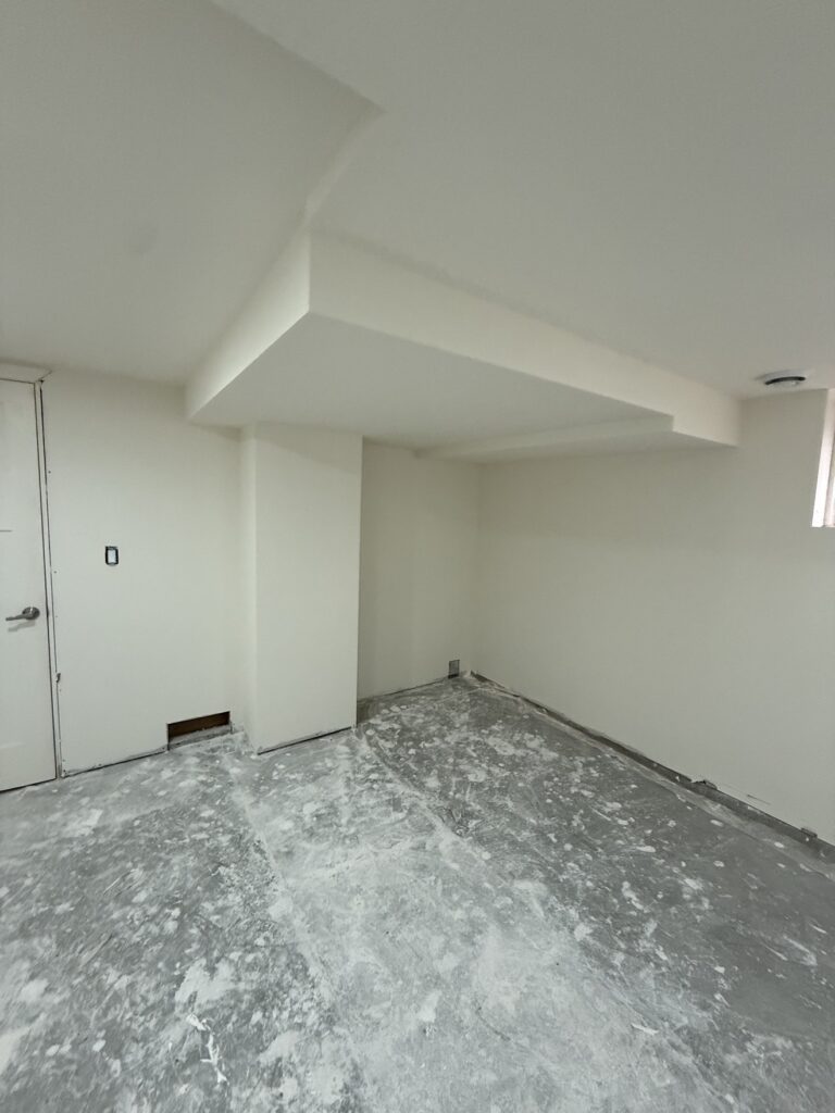 Basement insulation, drywall and painting project in Calgary by Renovo Painting Inc, finished painted basement walls