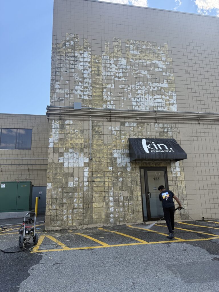 Pressure washing and cleaning stucco before painting in Calgary by Renovo Painting Inc