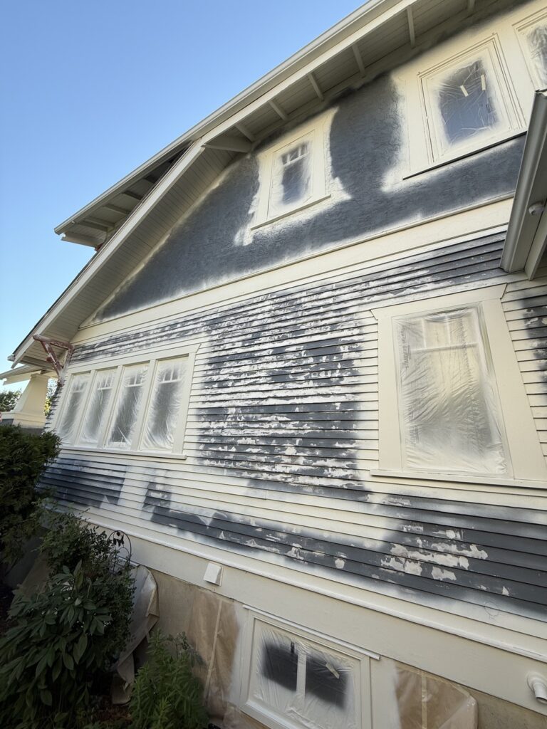 House siding during painting preparation by Renovo Painting Inc, Calgary