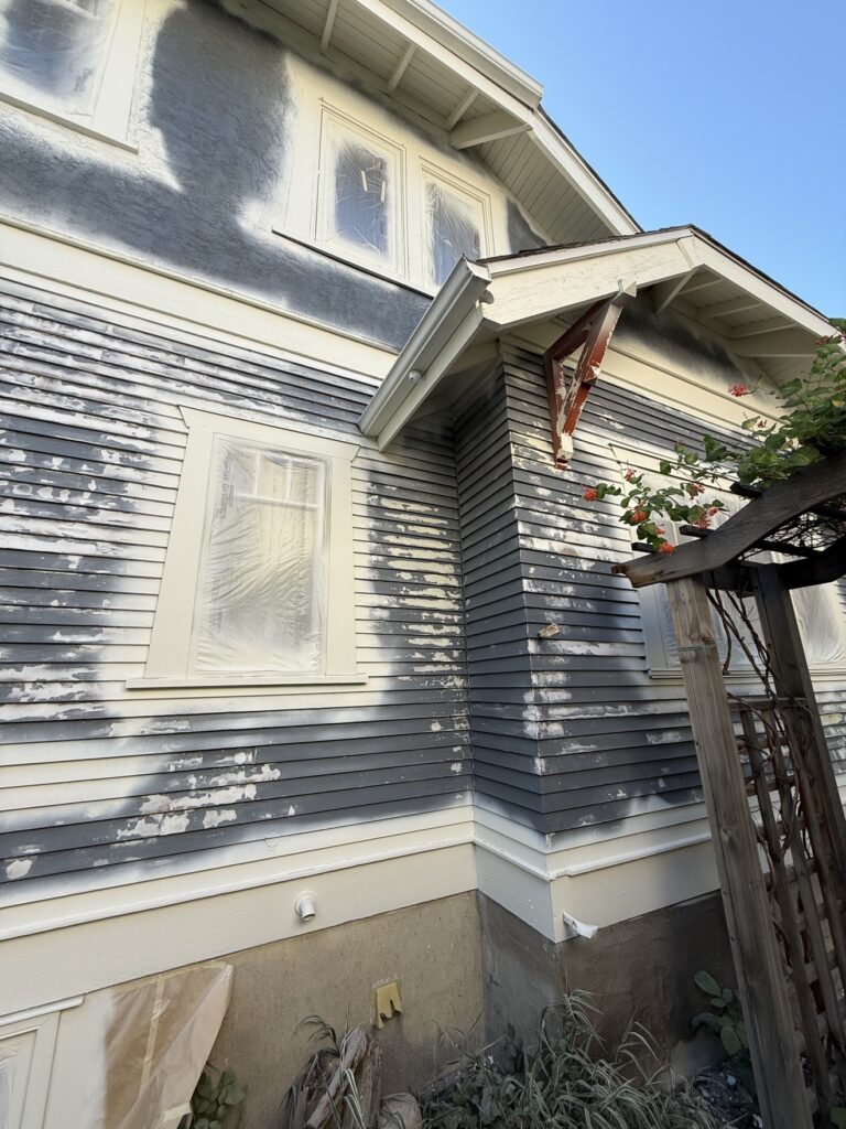 House siding during painting preparation by Renovo Painting Inc, Calgary