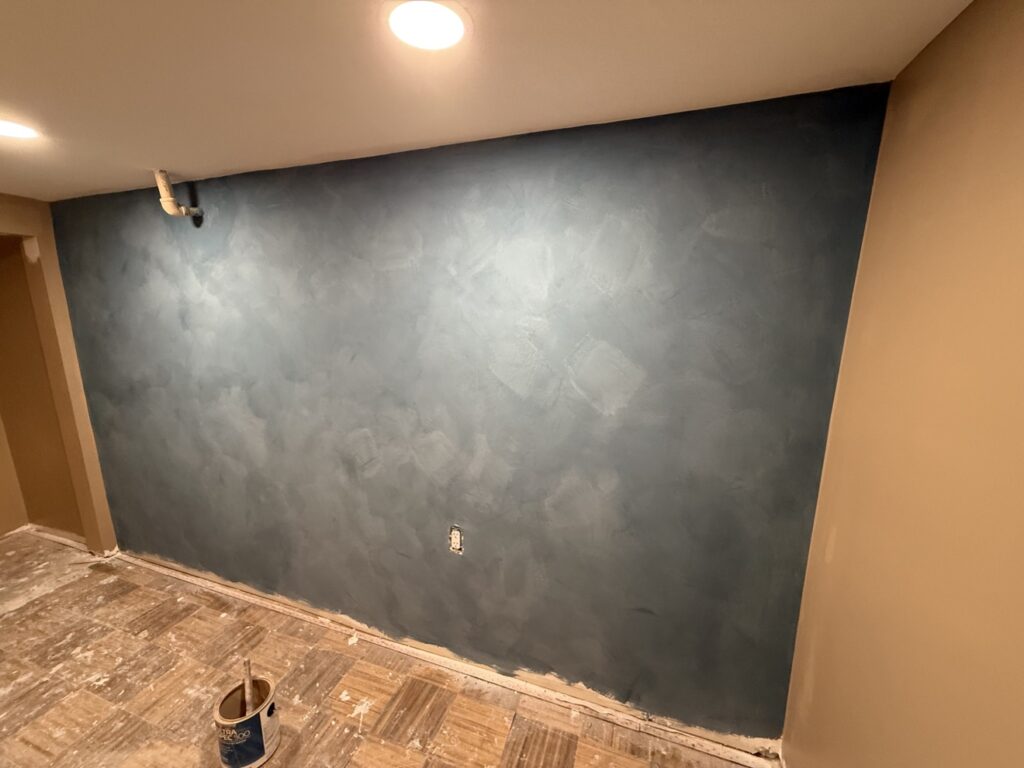 Limewash feature wall in a Calgary home, finished — Renovo Painting Inc