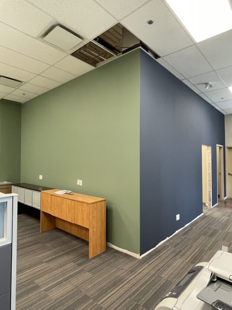 Commercial office wall built and painted by Renovo Painting Inc, Calgary