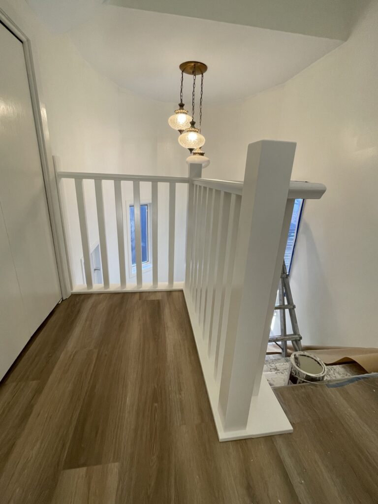 Close-up of finished painted railing by Renovo Painting Inc, Calgary