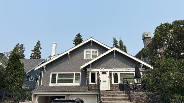 Stucco house exterior painted by Renovo Painting Inc in Calgary