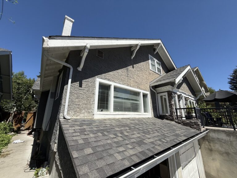 Stucco house exterior painted by Renovo Painting Inc in Calgary