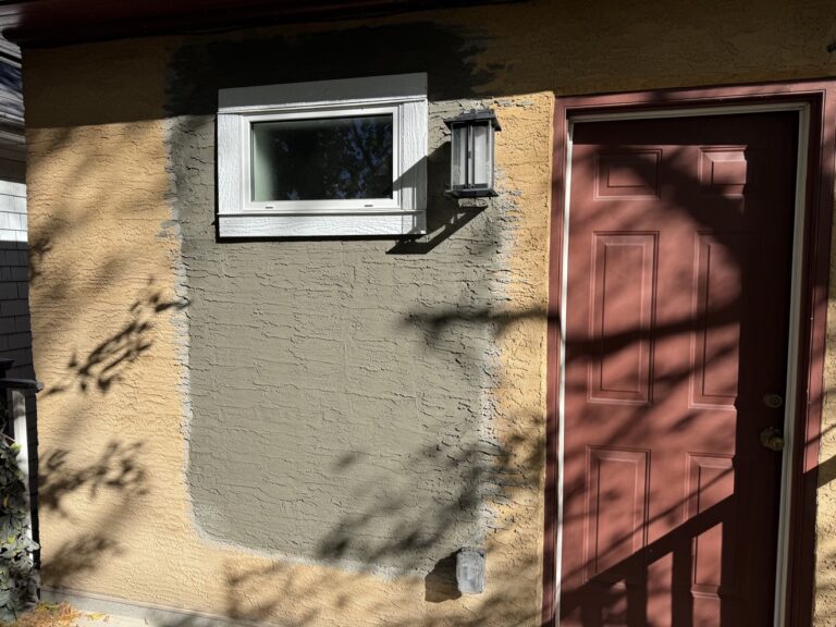Stucco repair in progress by Renovo Painting Inc, Calgary