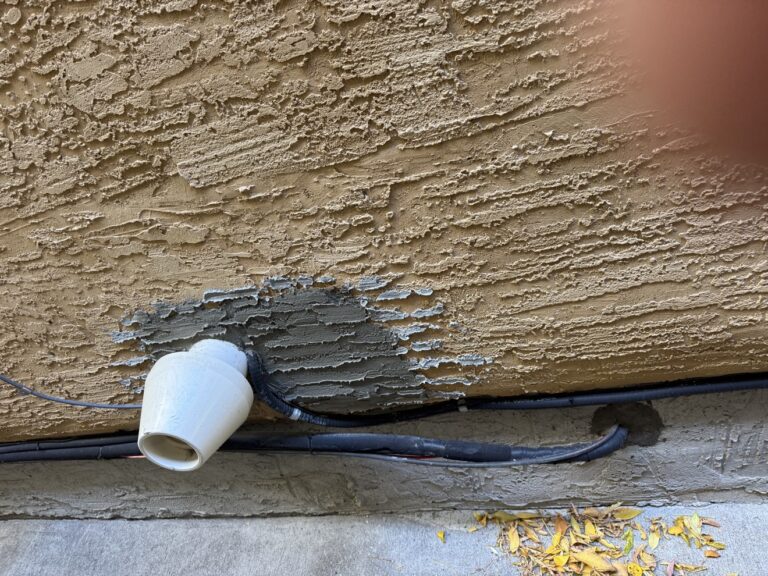 Stucco repair in progress by Renovo Painting Inc, Calgary