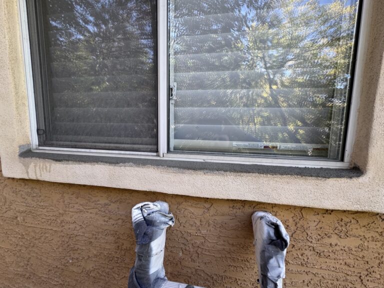 Stucco repair in progress by Renovo Painting Inc, Calgary