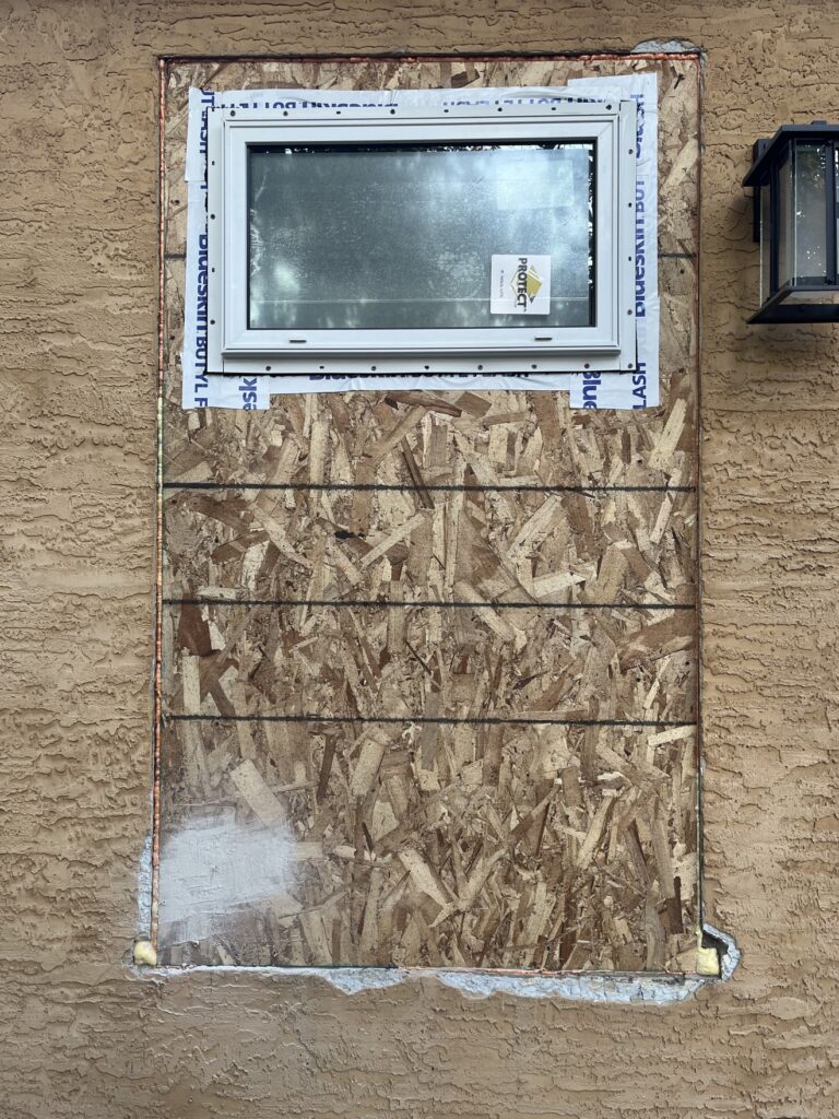 Stucco repair in progress by Renovo Painting Inc, Calgary