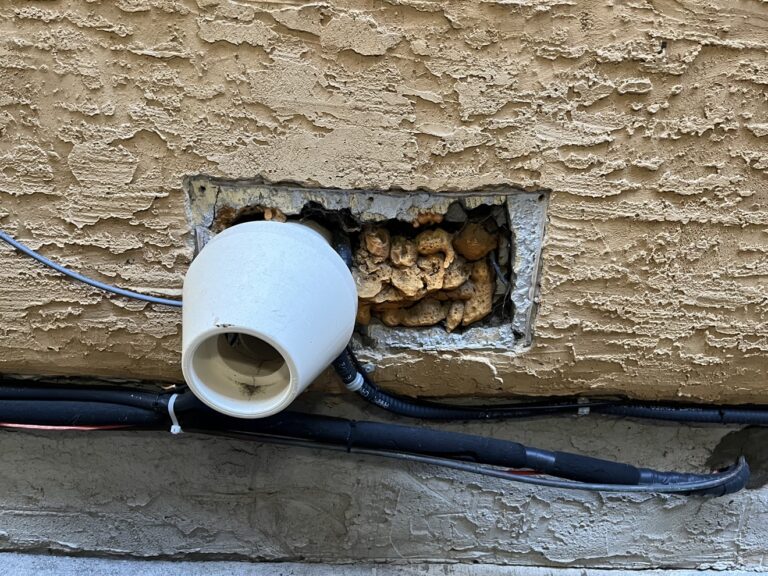 Stucco repair in progress by Renovo Painting Inc, Calgary